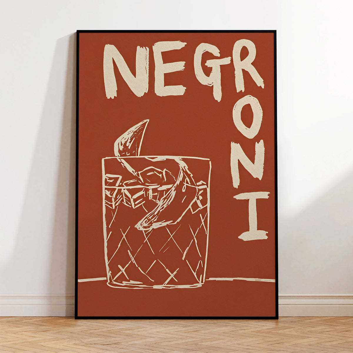 Framed artwork with 'Negroni' text and a glass illustration on a red background.