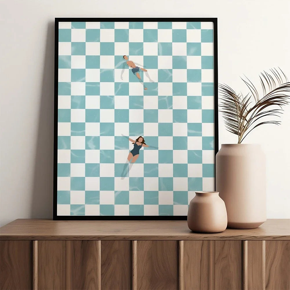 Framed checkered art print on a wooden shelf with decorative vases.
