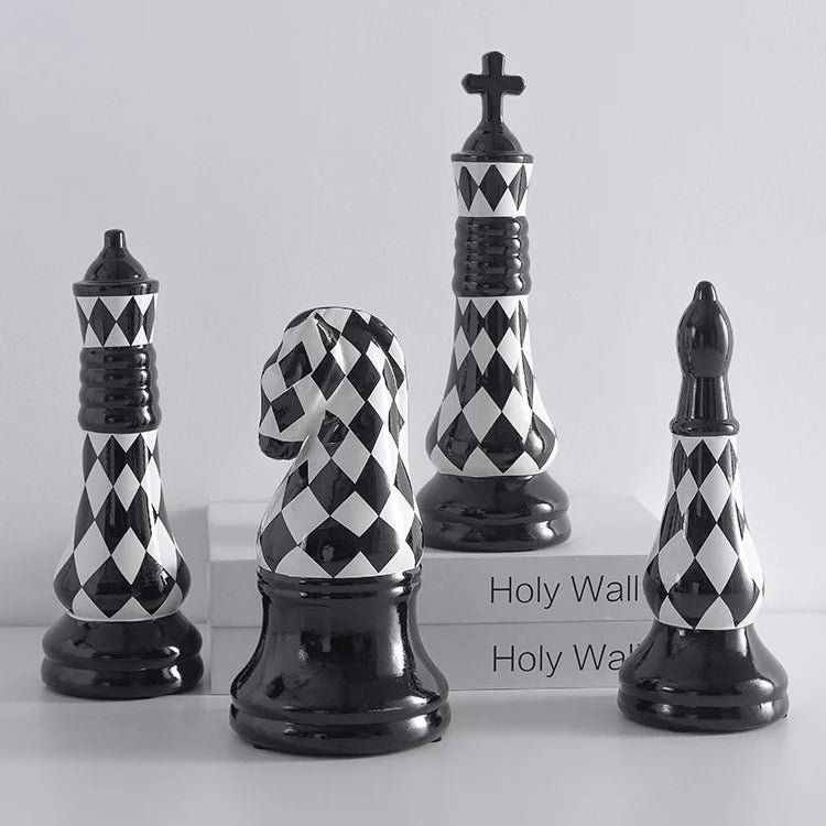 Set of decorative chess pieces with black and white checkered pattern on a light gray background.
