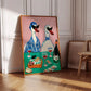 Framed artwork of two stylized ducks at a table with wine and food on a wall.