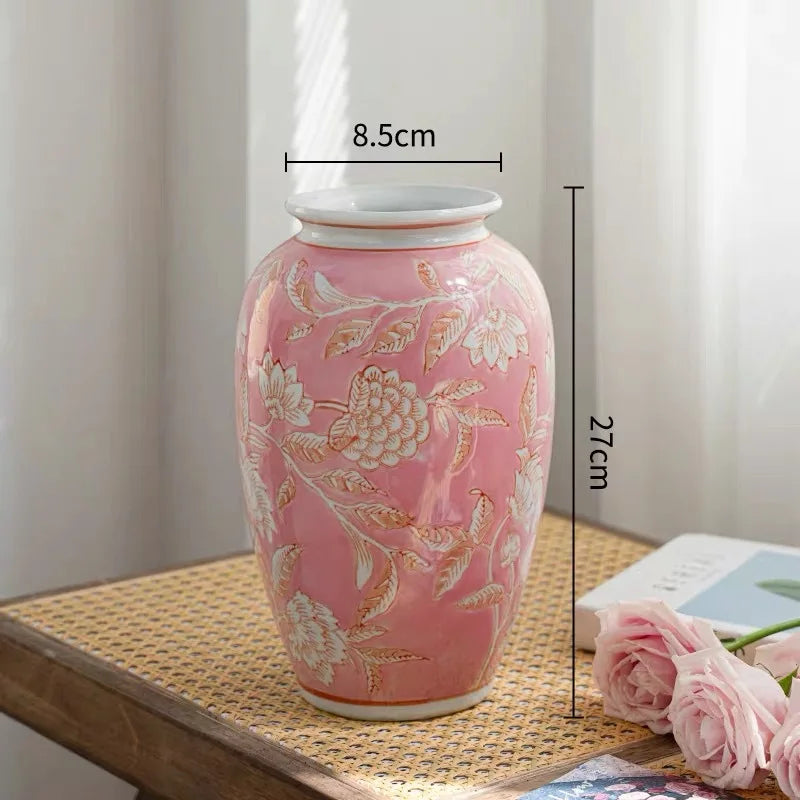 Pink floral vase with measurements on a wooden surface