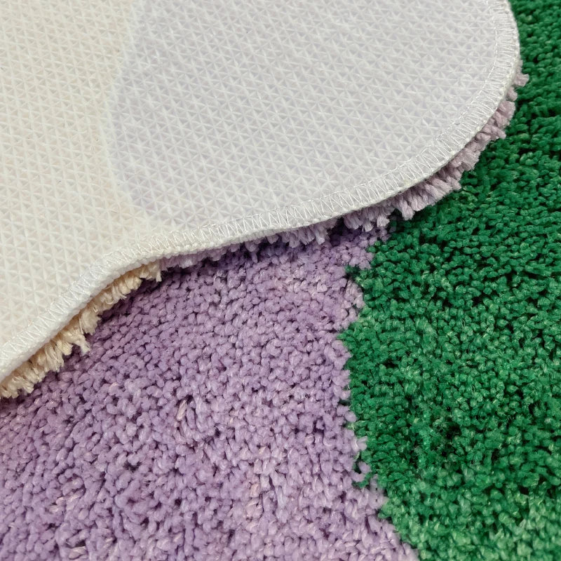 Close-up of textured rug with different color patterns