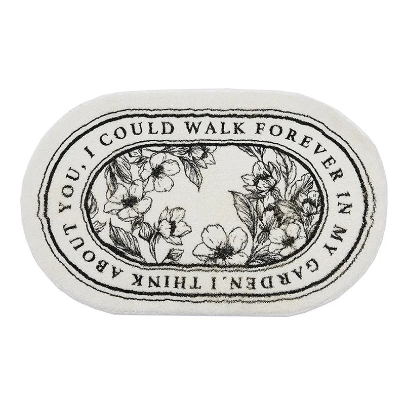 Decorative stone with floral design and text on a white background