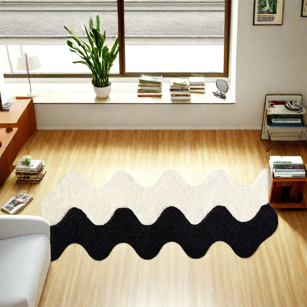 Wavy black and white rug on a wooden floor with a window and books in the background