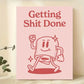 Poster with a cartoon character and 'Getting Shit Done' text on a pink background