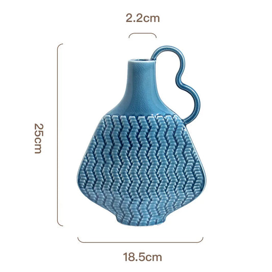 Blue textured vase with dimensions on a white background