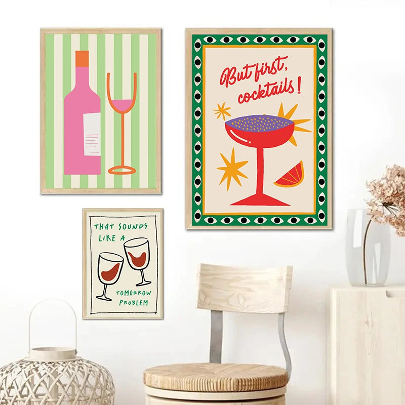 Three framed artworks on a wall with a chair and lantern in the foreground.