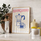 Framed 'Buongiorno Espresso' print on a kitchen counter with decorative items.