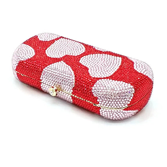 Red and white patterned clutch bag on a white background