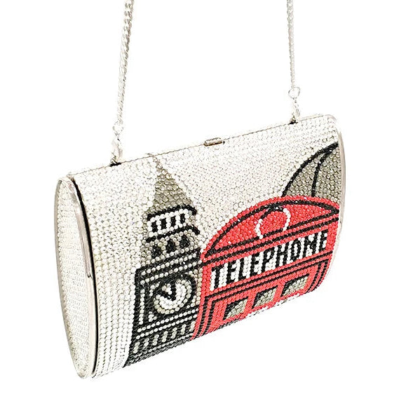 Designer handbag with London-themed design on a white background