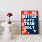 Framed artwork with 'Better Late Than Ugly' text on a decorative table.