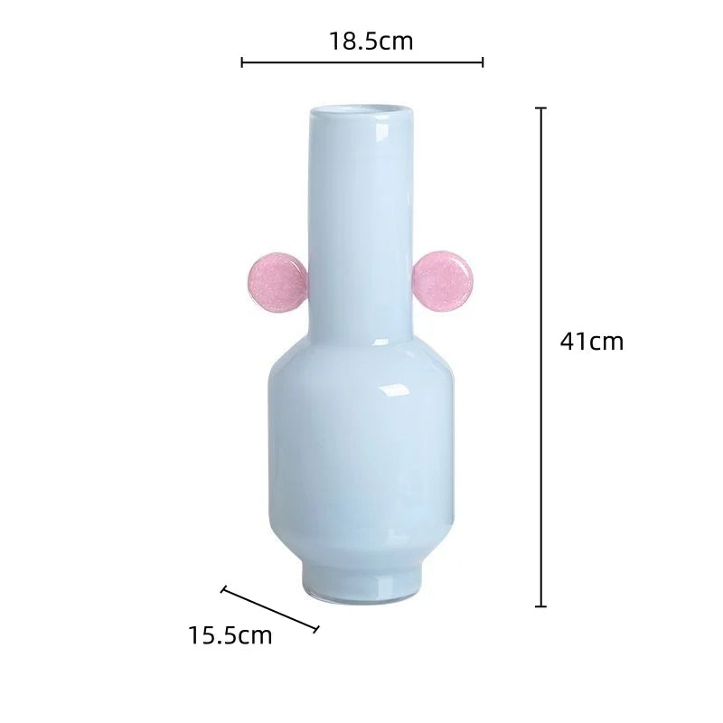 White vase with pink spherical decorations and measurements on a white background