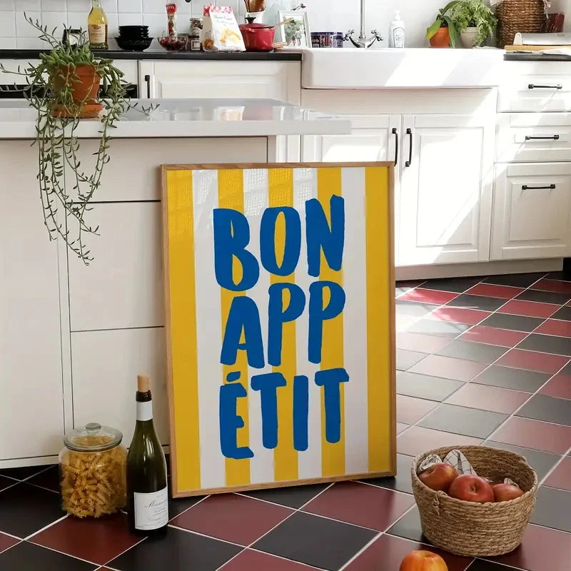 Kitchen scene with a 'Bon Appétit' sign, wine bottle, and basket of fruit.