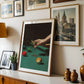 Framed artwork on a wall with decorative items including a lamp, vases, and a plant.