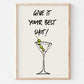 Framed print with a martini glass and 'Give it your best shot!' text on a white background