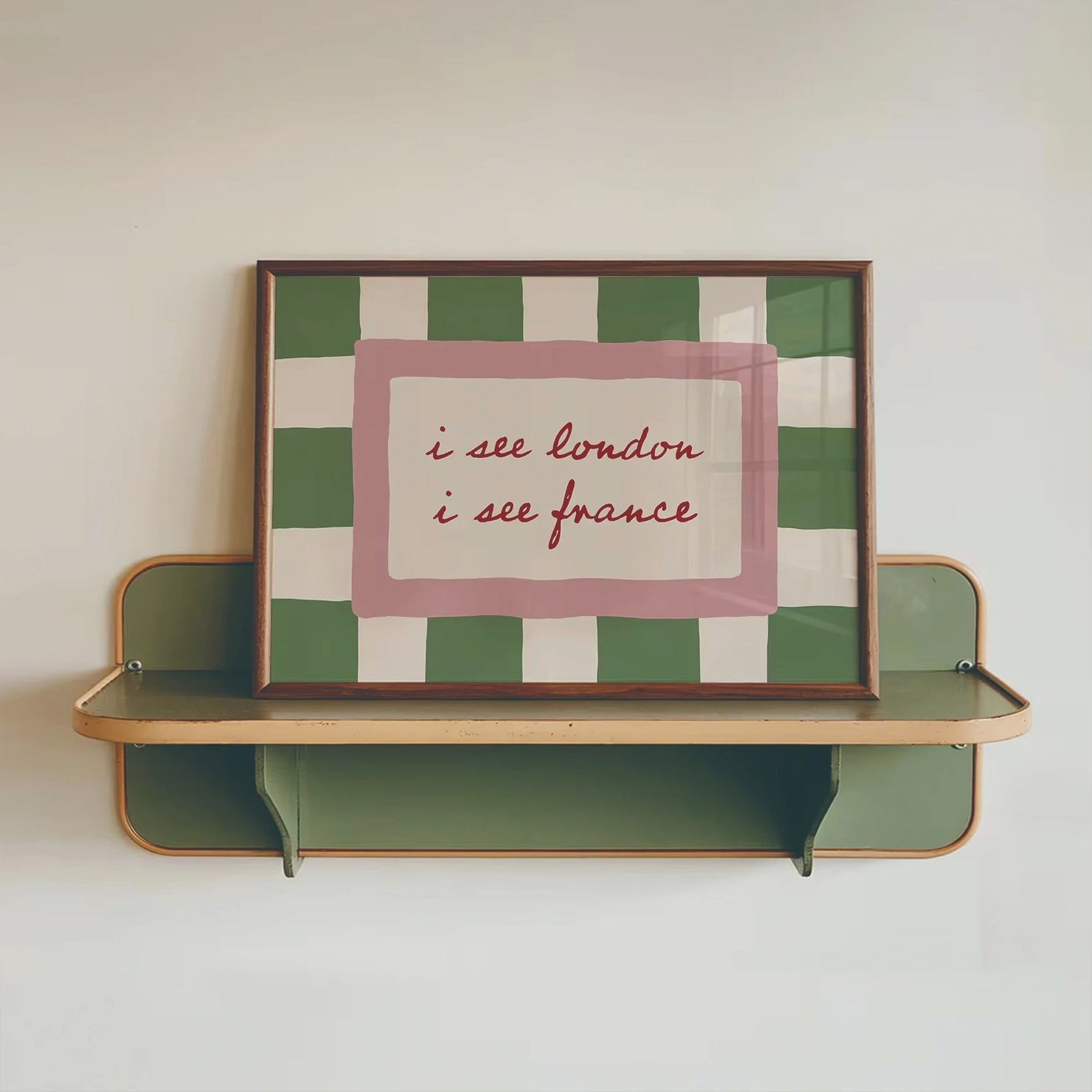 Decorative shelf with a framed checkered picture on a plain wall