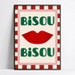Poster with red lips and 'Bisou Bisou' text on a checkered border