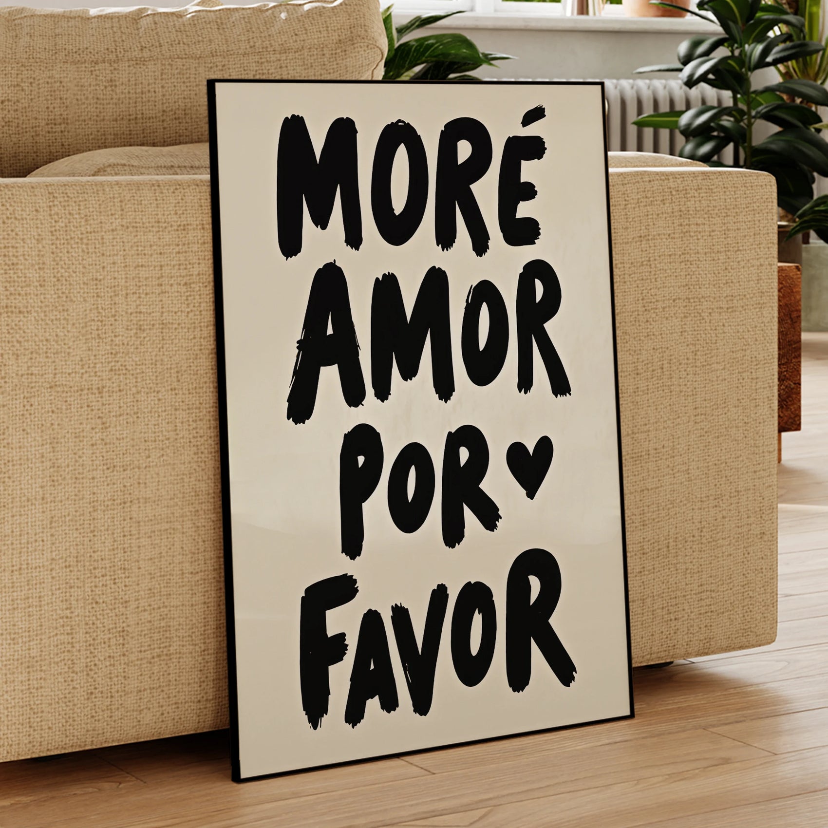Decorative sign with 'Moreá Amor Por Favor' text in a living room setting.