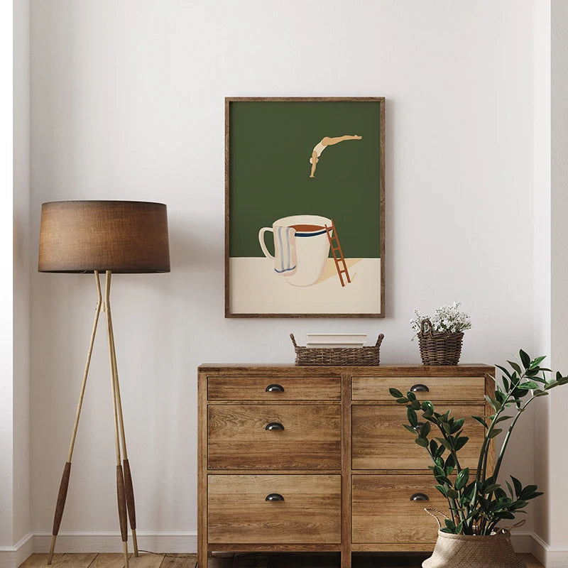 Wooden dresser with a lamp, plant, and framed artwork on a white wall.