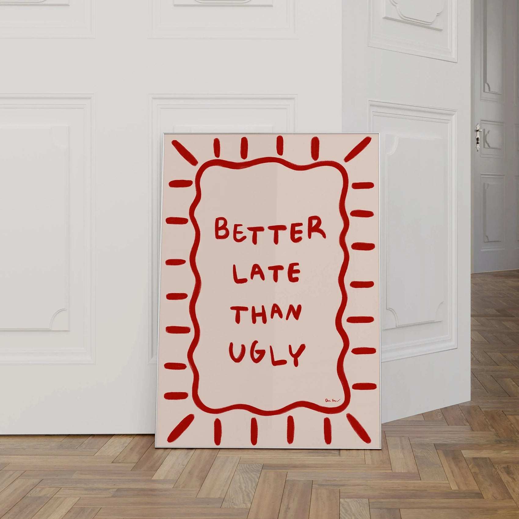 Canvas print with 'Better Late Than Ugly' text on a white wall.