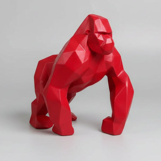 Red gorilla statue on a light gray background