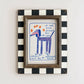 Framed artwork with a dog illustration and text on a white wall
