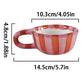 Red and white striped mug with dimensions on a white background