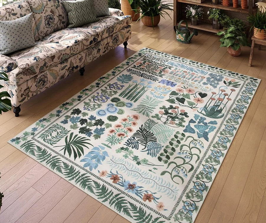 Decorative rug with animal and plant patterns on a wooden floor, with a patterned sofa in the background.