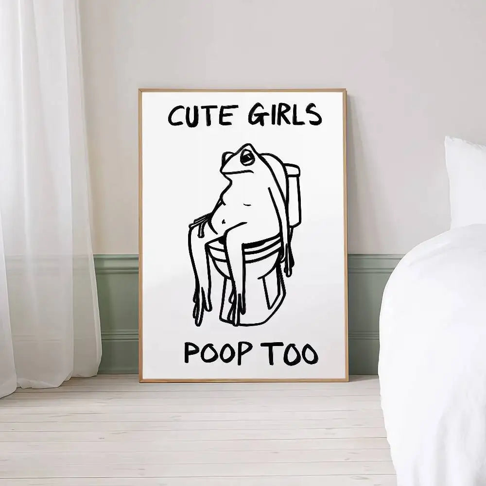 Framed artwork with a frog illustration and text on a wall.