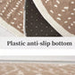 Close-up of a rug with a plastic anti-slip bottom label
