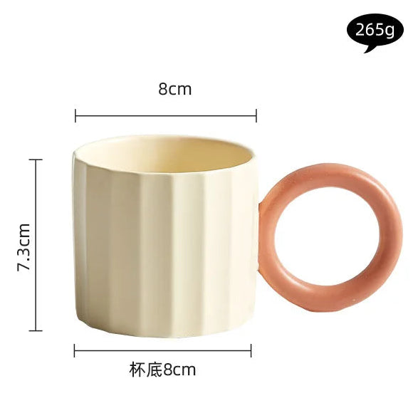 Beige mug with a pink handle and measurements on a white background