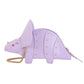 Lavender dinosaur-shaped handbag with gold chain on a white background