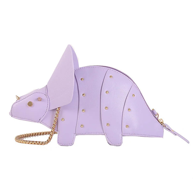 Lavender dinosaur-shaped handbag with gold chain on a white background