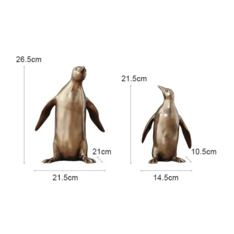Two penguin figurines with measurements on a white background