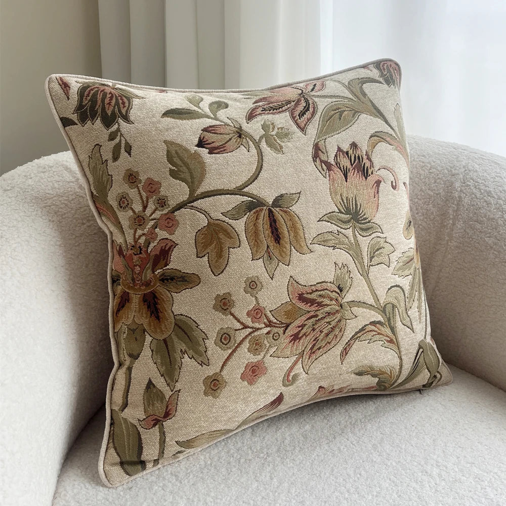 Floral patterned pillow on a beige sofa