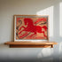 Framed vintage matchbox design with a horse illustration on a wooden shelf.