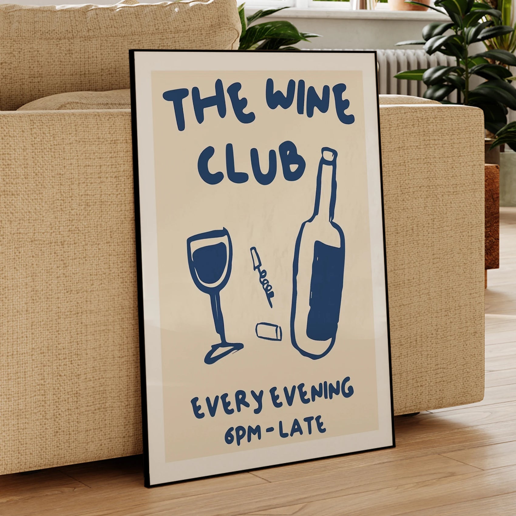 Framed poster with 'The Wine Club' text and wine graphics on a beige background.
