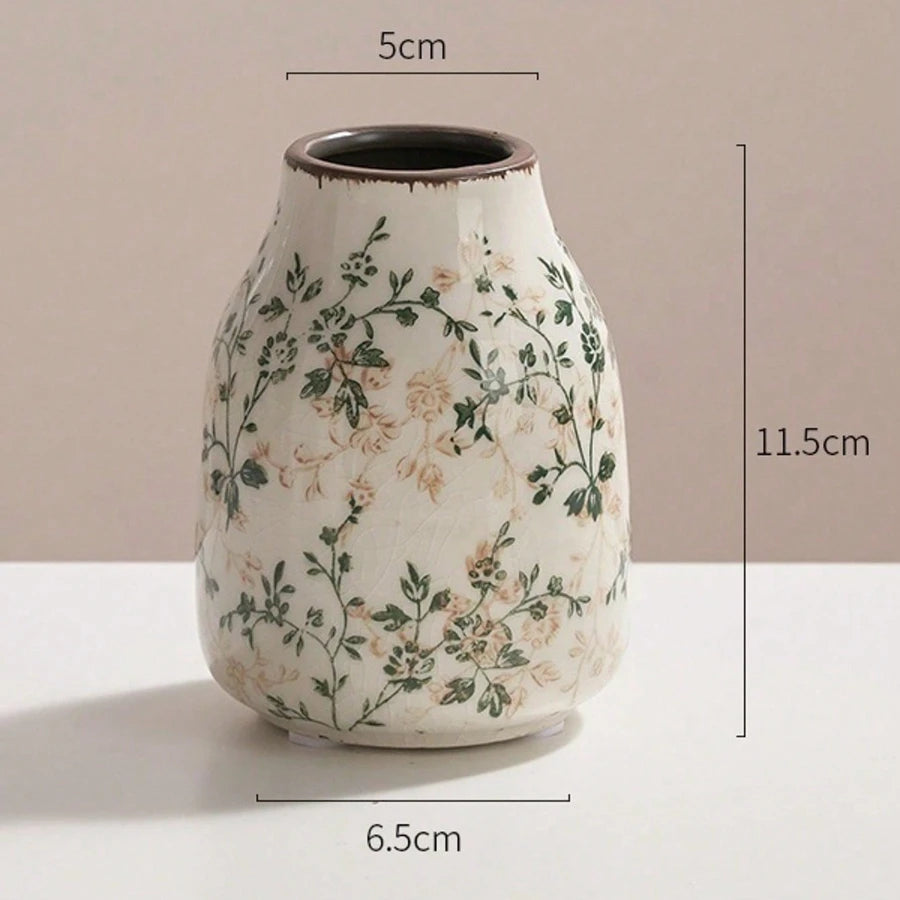 Ceramic vase with floral patterns and dimensions on a beige background