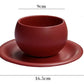 Red ceramic cup and saucer with dimensions on a white background