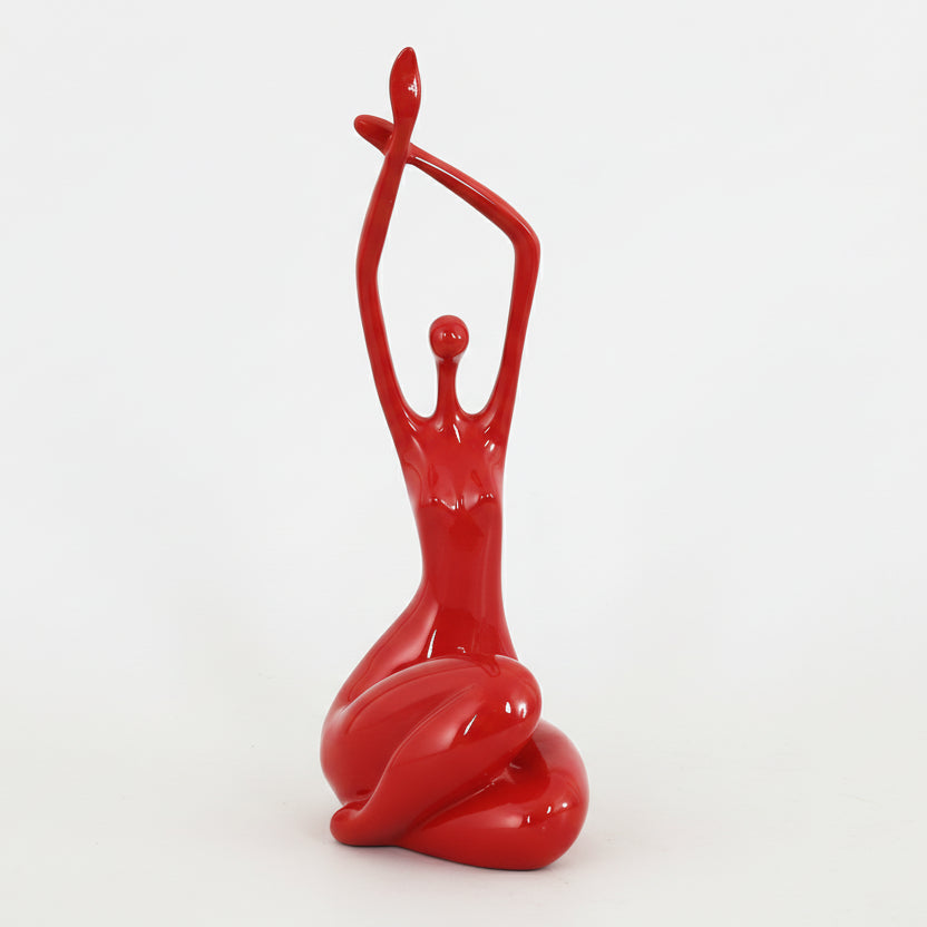 Red abstract sculpture on a light blue background