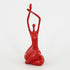 Red abstract sculpture on a light blue background