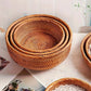 Set of woven baskets on a light surface with a blurred background