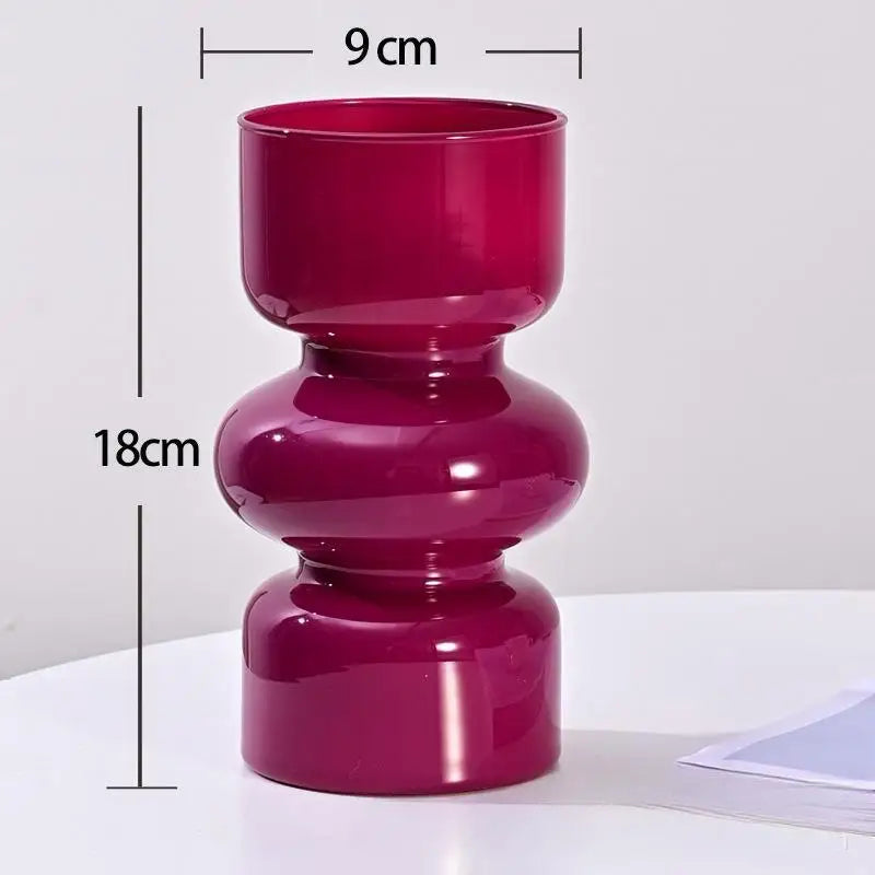 Pink vase with measurements on a white background