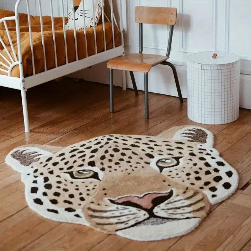Leopard-shaped rug on a wooden floor in a room with a crib and chair.
