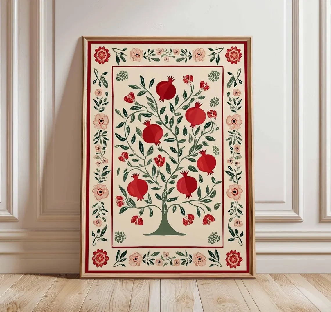 Decorative wall art with pomegranate design on a white wall.