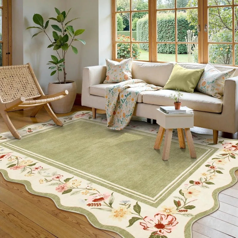 Living room with a floral rug, beige sofa, and wooden chair.