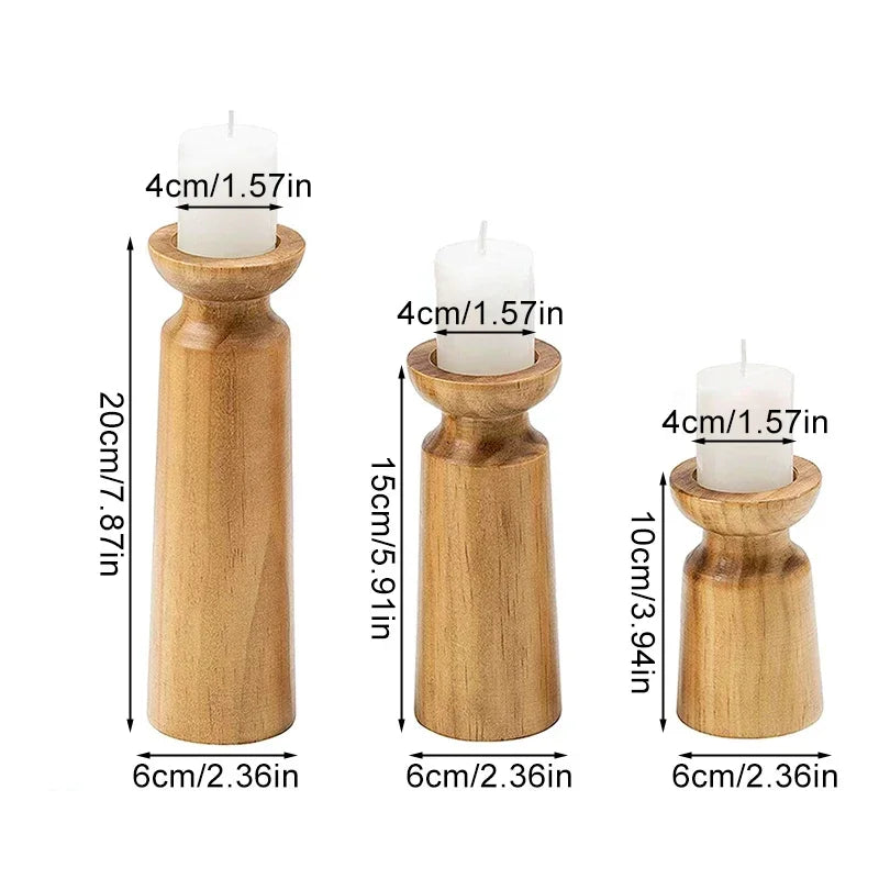 Three wooden candle holders with candles inside, showing measurements on a white background.