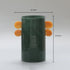 Green sculptural vase with orange circular handles for colorful interior styling