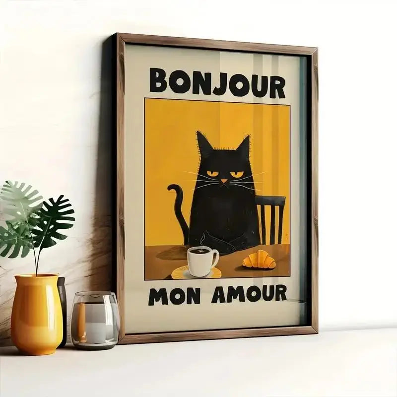 Framed poster with a black cat, coffee cup, and croissant on a yellow background with 'Bonjour Mon Amour' text.
