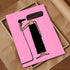 Illustration of a person with a hair dryer on a pink background, framed in a wooden box.